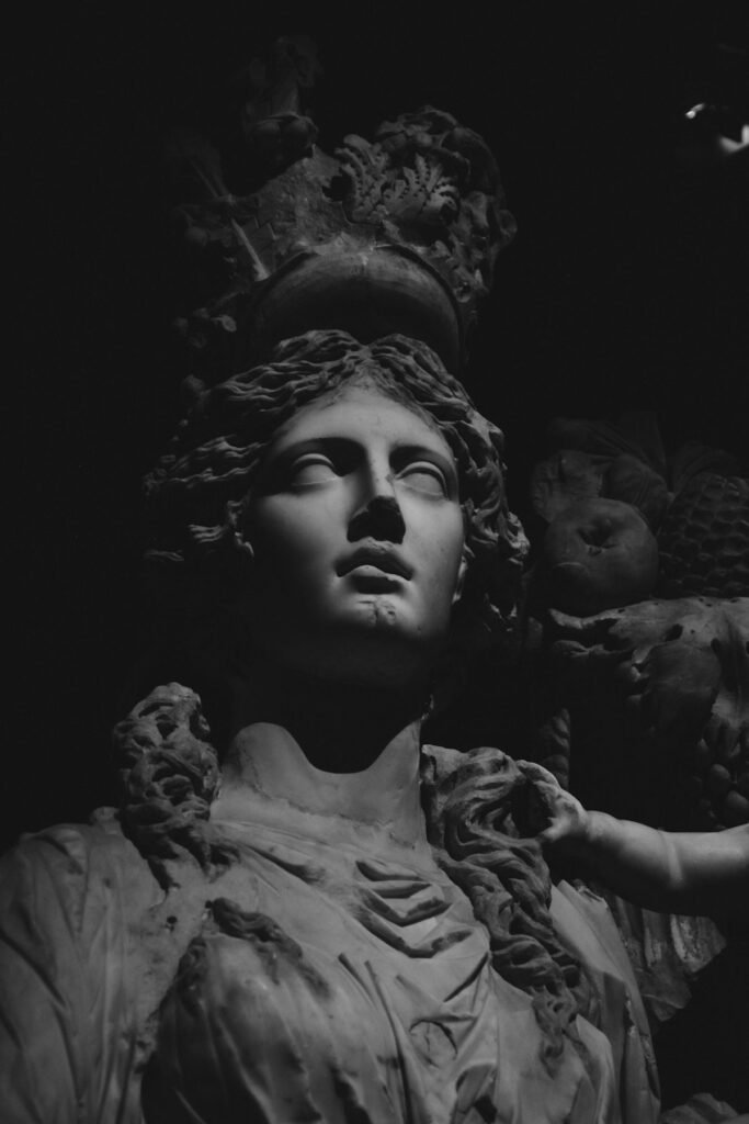 Classical marble sculpture in dramatic light